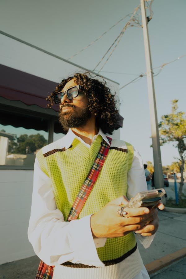 free-photo-of-a-man-with-long-hair-and-beard-wearing-a-vest-and-sunglasses